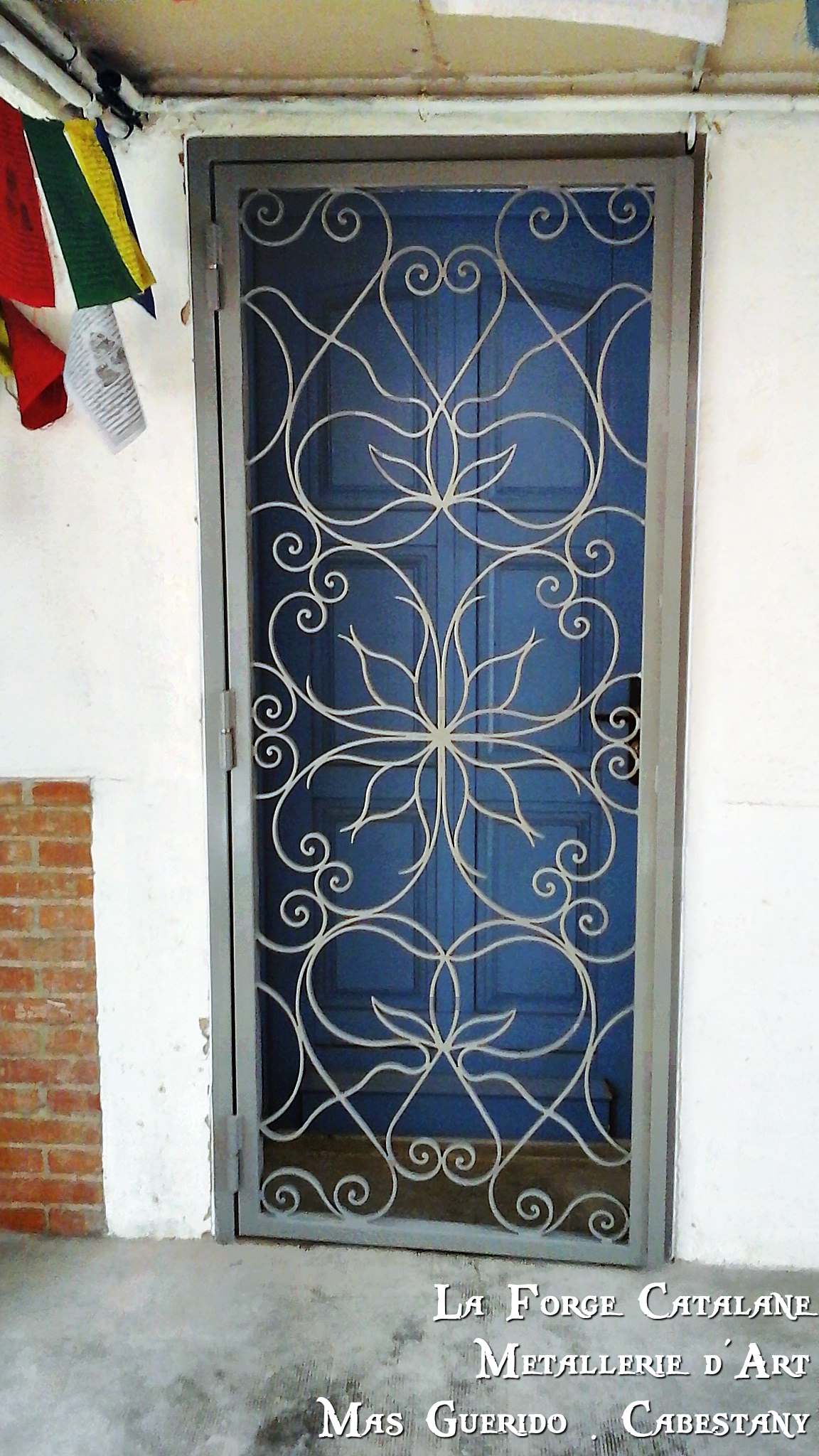 grille articulee volutes inspiration fleurs forge catalane.jpg